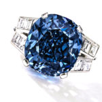 This undated photo provided by Sothebys shows the 9.54 carat blue diamond ring worn for decades by child star-turned-ambassador Shirley Temple, which is going up for auction on April 19, 2016 by Sotheby's in New York. The ring, purchased in 1940 by her father for Temple's 12th birthday for $7,210, now has a pre-sale estimate of between $25 million and $35 million. (Sotheby's via AP)